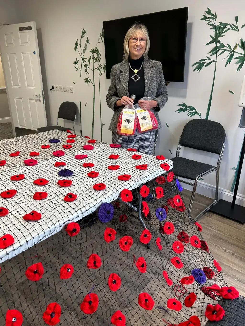 VTN Chairman Fran Webb with knitted poppies for Remembrance Day 2025